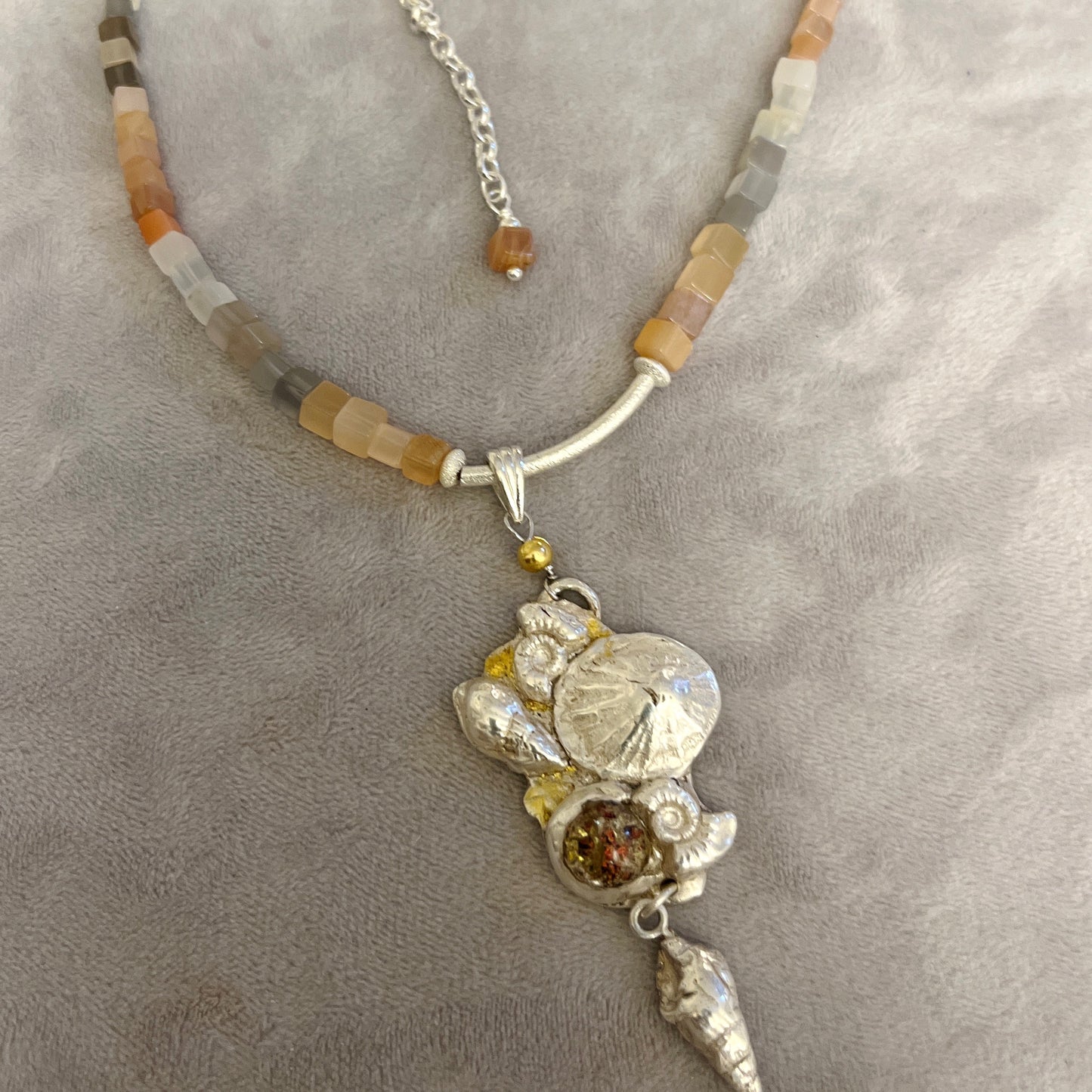 Along the sea-shore A pendant using fine silver and gold leaf strung on a moonstone and silver chain